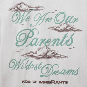 KIDS OF IMMIGRANTS WE ARE OUR PARENTS WILDEST DREAMS LOGO WITH CLOUDS